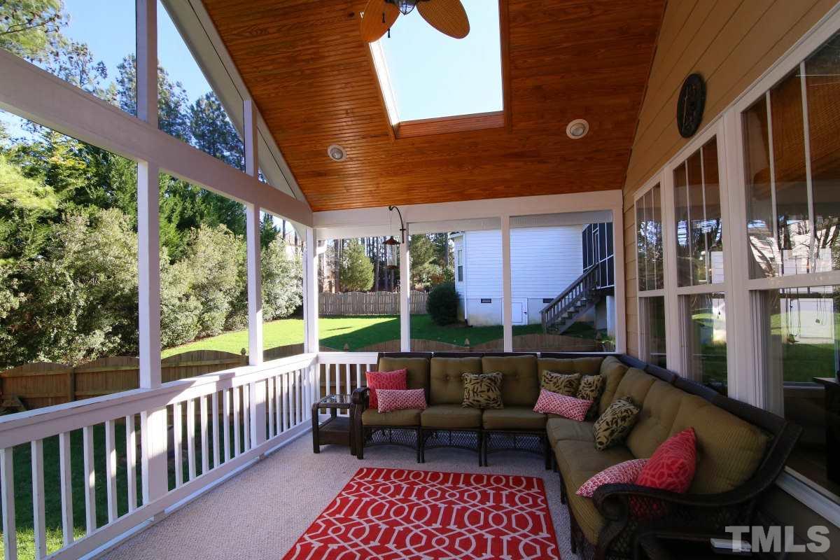1128 Coram Fields Road Wake Forest, NC 27587 - Photo 21 of 25 This lovely custom screened porch is a great place to relax and enjoy the outdoors.