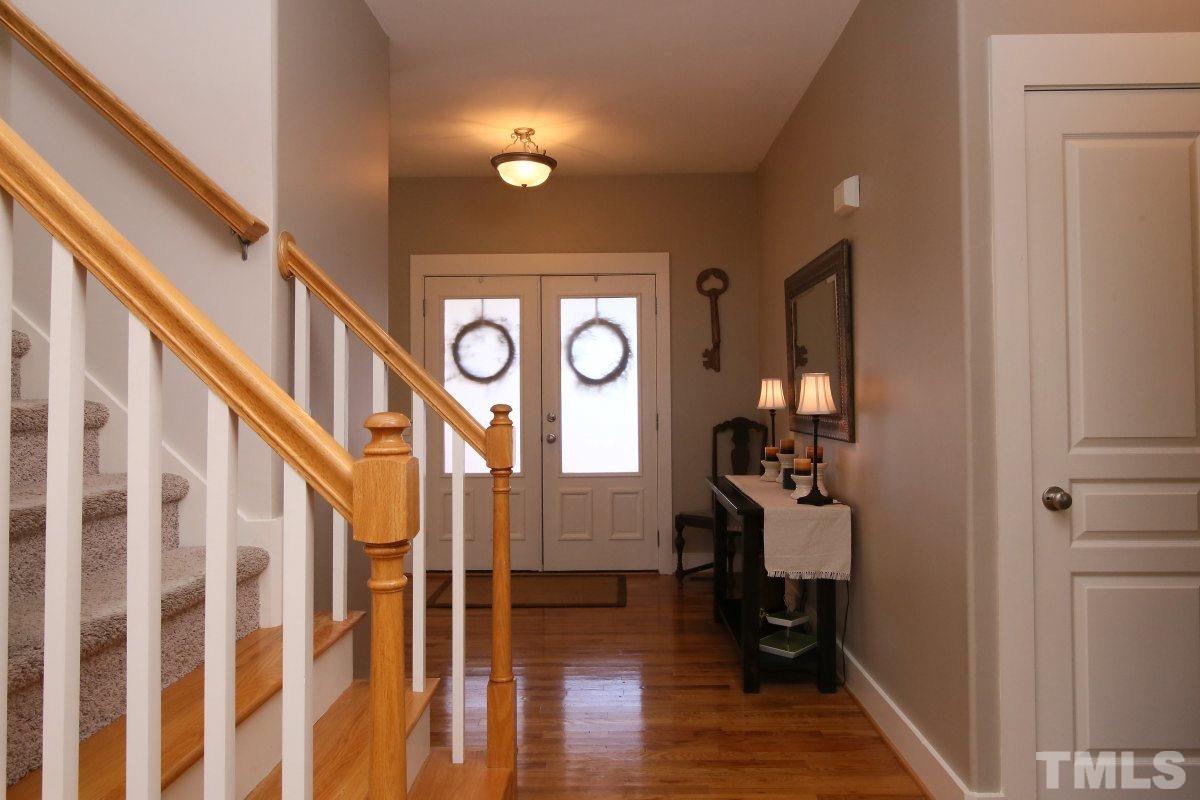 1128 Coram Fields Road Wake Forest, NC 27587 - Photo 4 of 25 Large foyer with hardwood floors is very welcoming!