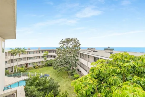 a view of a large building with a yard