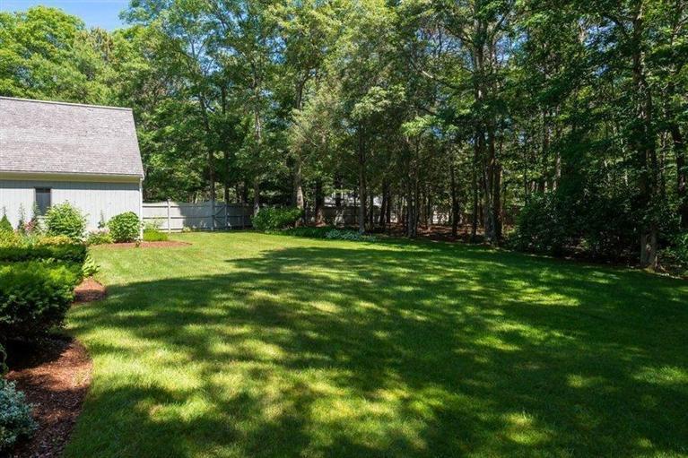 81 Leonard Road Osterville, MA 02655 - Photo 3 of 19 a backyard of a house with lots of green space and fountain