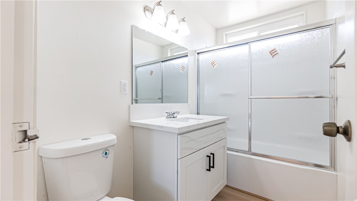 9293 Guava Avenue Hesperia, CA 92345 - Photo 13 of 32 a bathroom with a sink toilet and shower