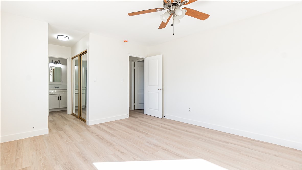 9293 Guava Avenue Hesperia, CA 92345 - Photo 17 of 32 a view of a room with a ceiling fan and refrigerator