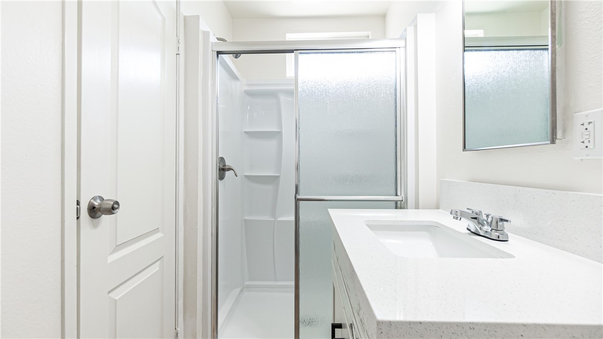 9293 Guava Avenue Hesperia, CA 92345 - Photo 20 of 32 a bathroom with a sink and a mirror