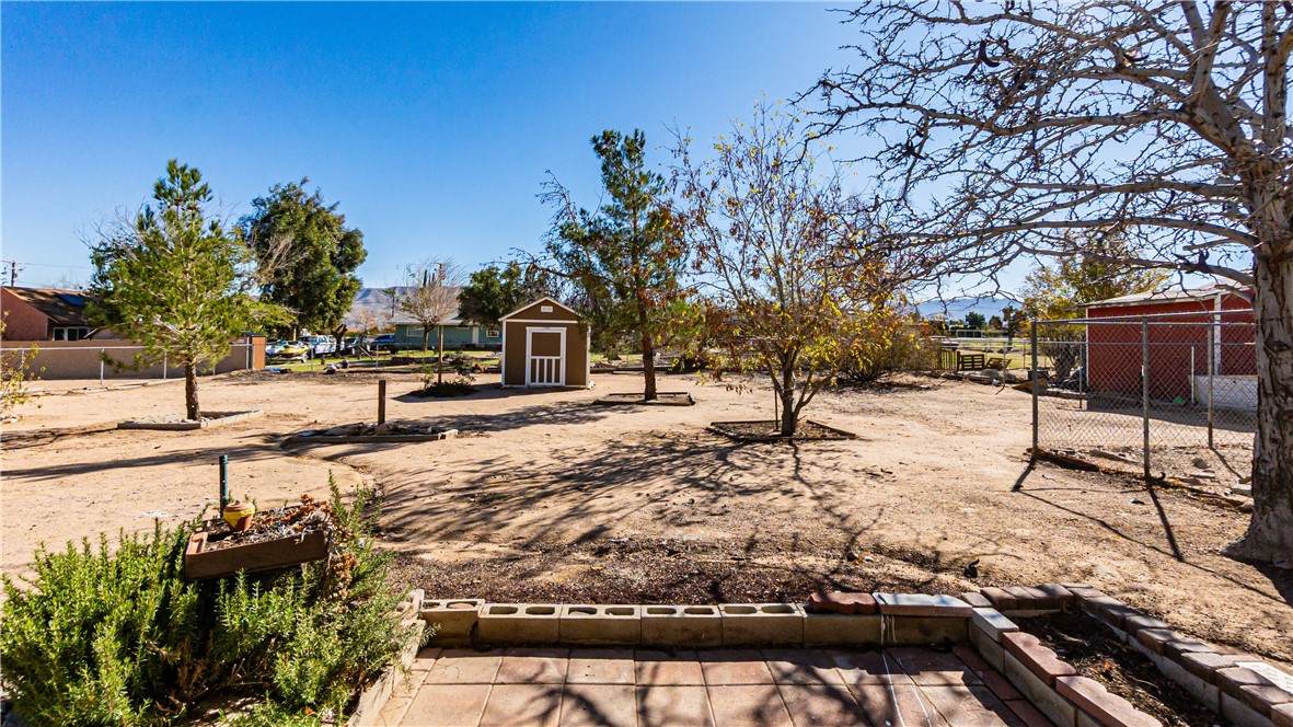 9293 Guava Avenue Hesperia, CA 92345 - Photo 24 of 32 a view of street with view of trees