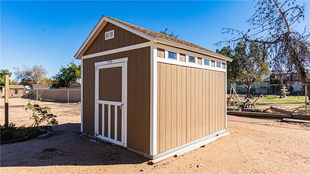 9293 Guava Avenue Hesperia, CA 92345 - Photo 30 of 32 a view of a house with a yard