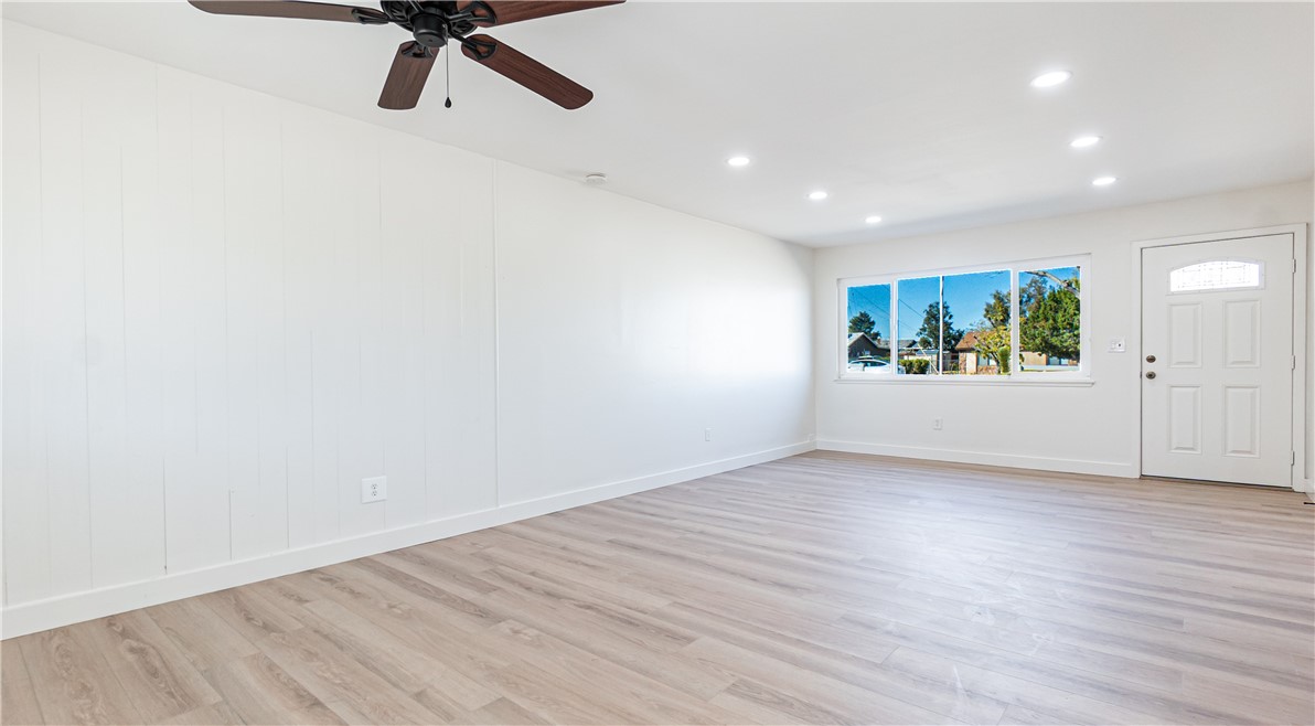 9293 Guava Avenue Hesperia, CA 92345 - Photo 4 of 32 a view of a room with wooden floor and window
