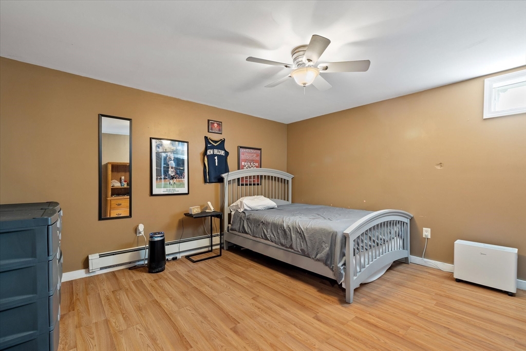 27 Ware Drive Templeton, MA 01436 - Photo 20 of 34 a bedroom with a bed and lamp on desk