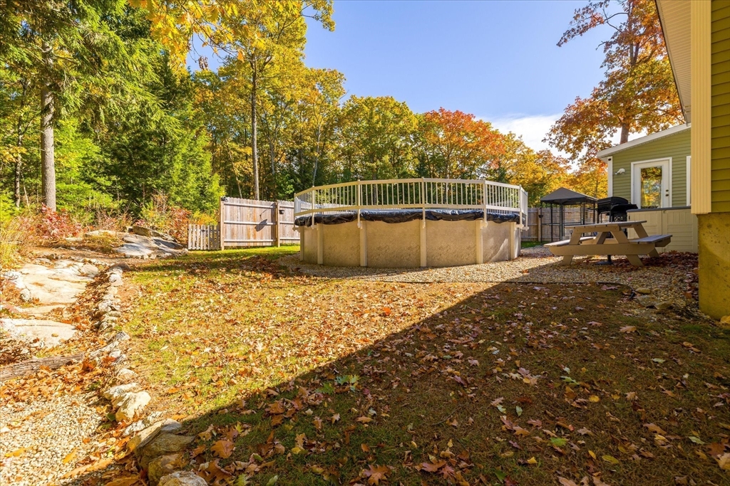 27 Ware Drive Templeton, MA 01436 - Photo 25 of 34 a backyard of a house with large trees