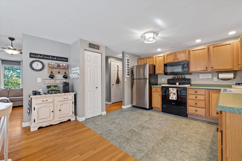 27 Ware Drive Templeton, MA 01436 - Photo 7 of 34 a kitchen with stainless steel appliances a refrigerator sink and cabinets