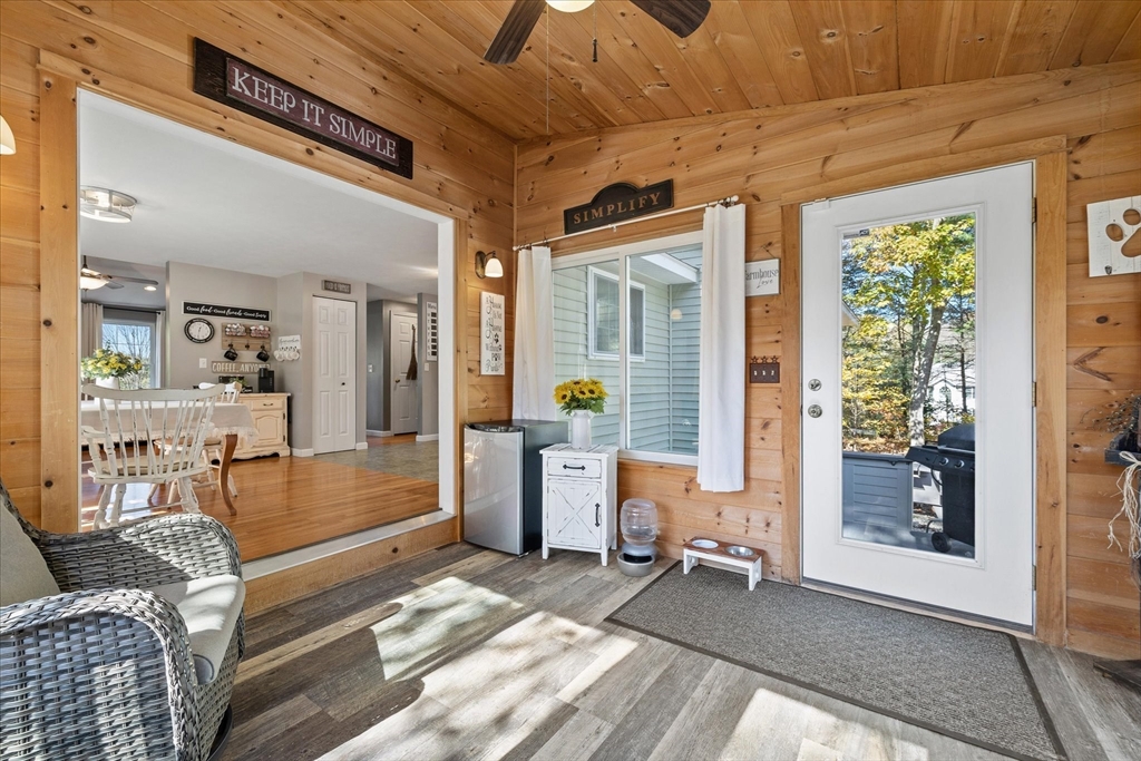 27 Ware Drive Templeton, MA 01436 - Photo 10 of 34 a living room with furniture and a table with wooden floor