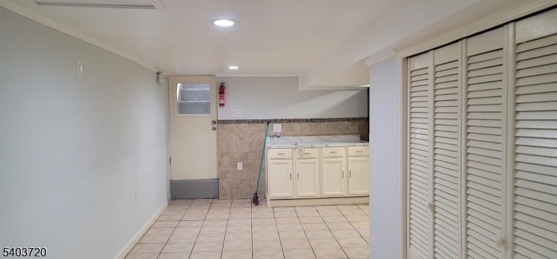 43 Patterson Street Newark, NJ 07105 - Photo 12 of 15 a view of kitchen with refrigerator and cabinets