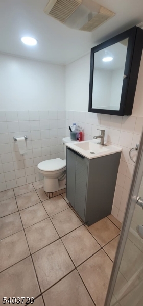 43 Patterson Street Newark, NJ 07105 - Photo 13 of 15 a bathroom with a toilet sink and mirror