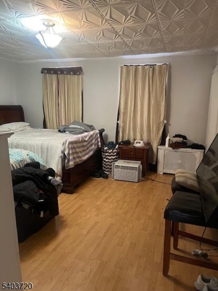 43 Patterson Street Newark, NJ 07105 - Photo 5 of 15 a bedroom with a bed and a couch