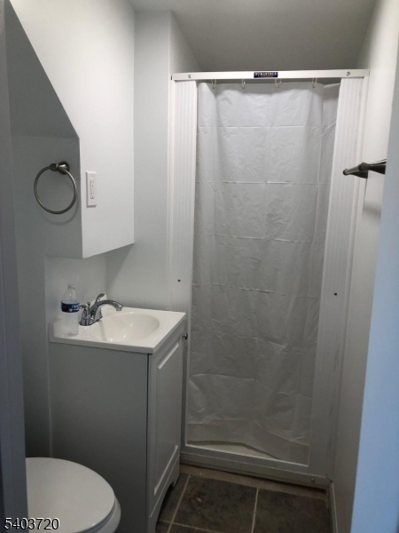 43 Patterson Street Newark, NJ 07105 - Photo 10 of 15 a bathroom with a sink toilet and shower