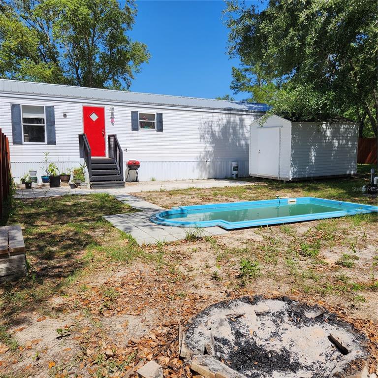 11131 Northeast 61 Street Bronson, FL 32621 - Photo 1 of 1 a view of outdoor space yard and garage