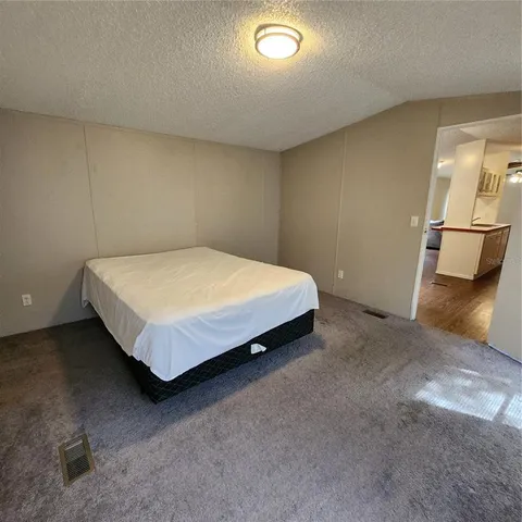 a bed sitting in a room