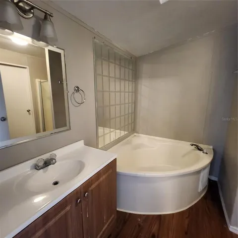 a bathroom with a bathtub and sink