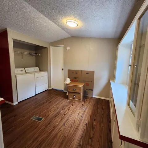 a living room with a bed and furniture