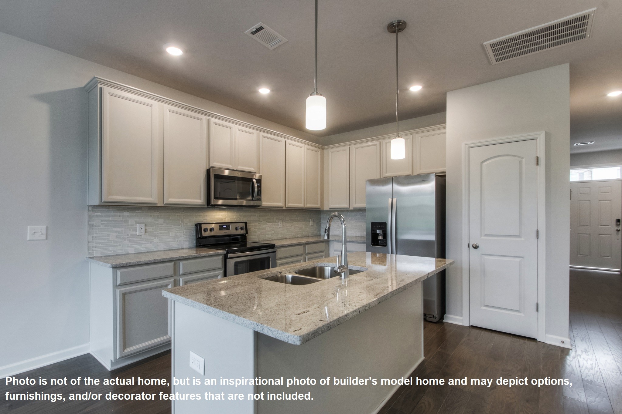 321 Cheval Drive Gallatin, TN 37066 - Photo 5 of 11 a kitchen with stainless steel appliances granite countertop a sink a stove a refrigerator a microwave a sink and white cabinets