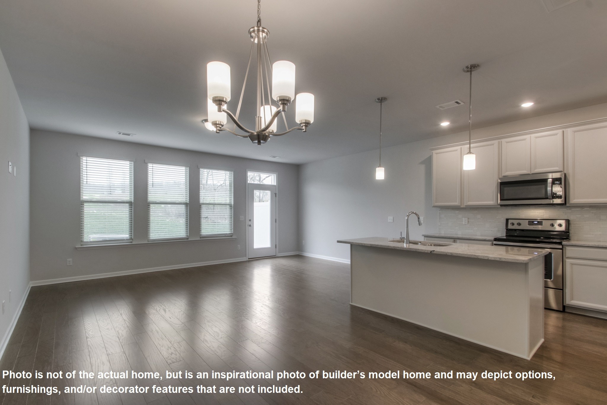 321 Cheval Drive Gallatin, TN 37066 - Photo 7 of 11 a view of a kitchen with granite countertop stainless steel appliances and a chandelier