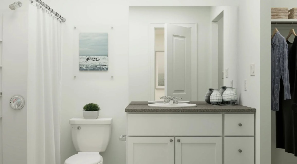 924 Pertuso Lane Huffman, TX 77336 - Photo 13 of 14 a bathroom with a granite countertop sink toilet and mirror