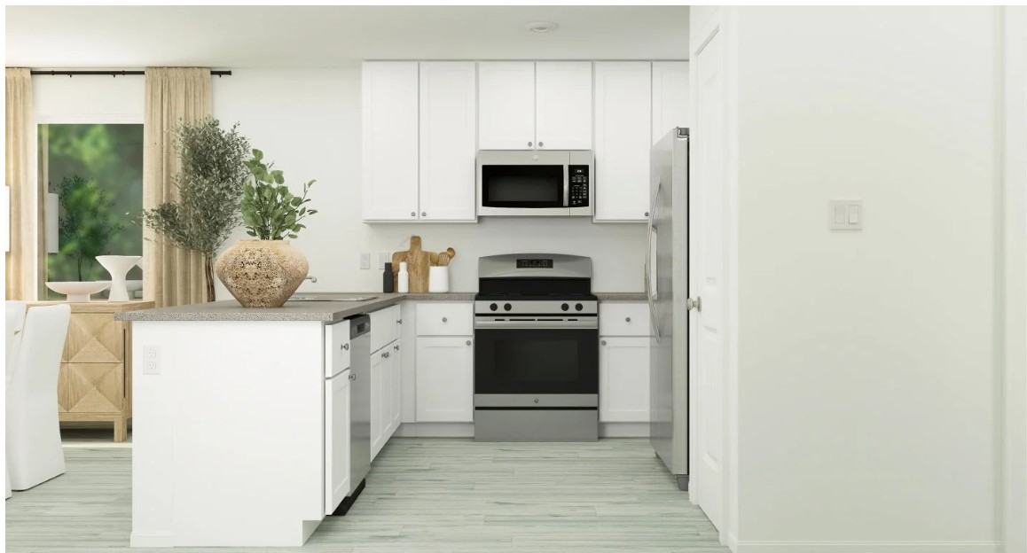 924 Pertuso Lane Huffman, TX 77336 - Photo 8 of 14 a kitchen with stainless steel appliances a stove microwave and refrigerator