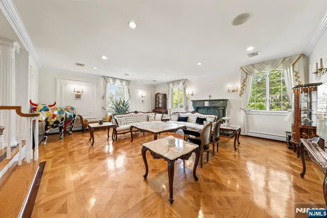 a bedroom with two beds and a large window