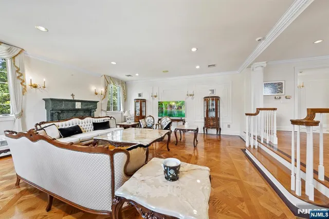 a reading room with furniture and a book shelf