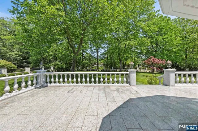 a view of a chair and tables in the balcony
