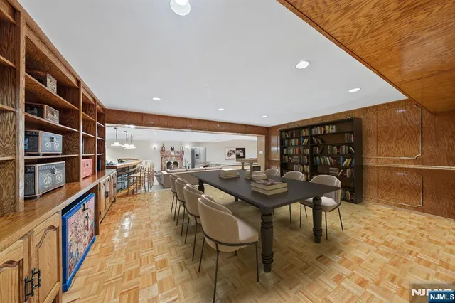 a reading room with furniture and a book shelf