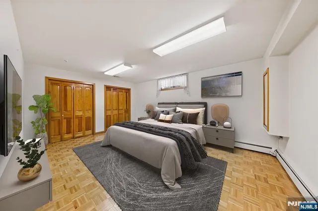 a bedroom with bed and a couch