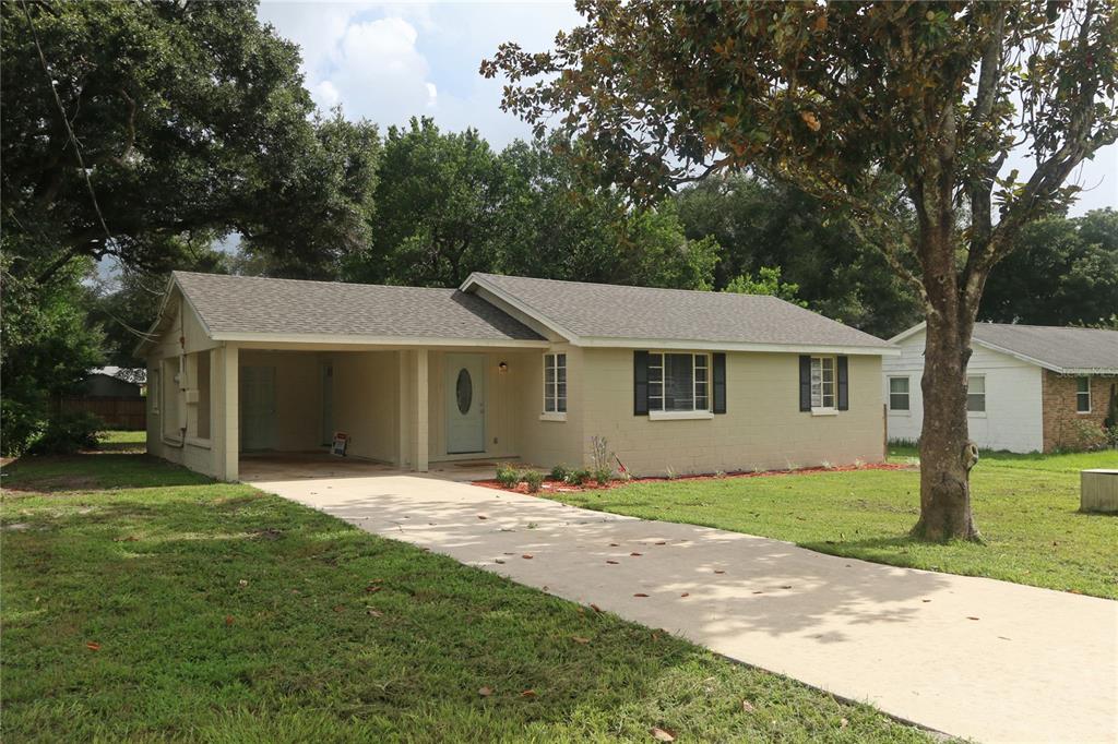 148 Angeles Road DeBary, FL 32713 - Photo 1 of 1 a front view of a house with a garden and yard