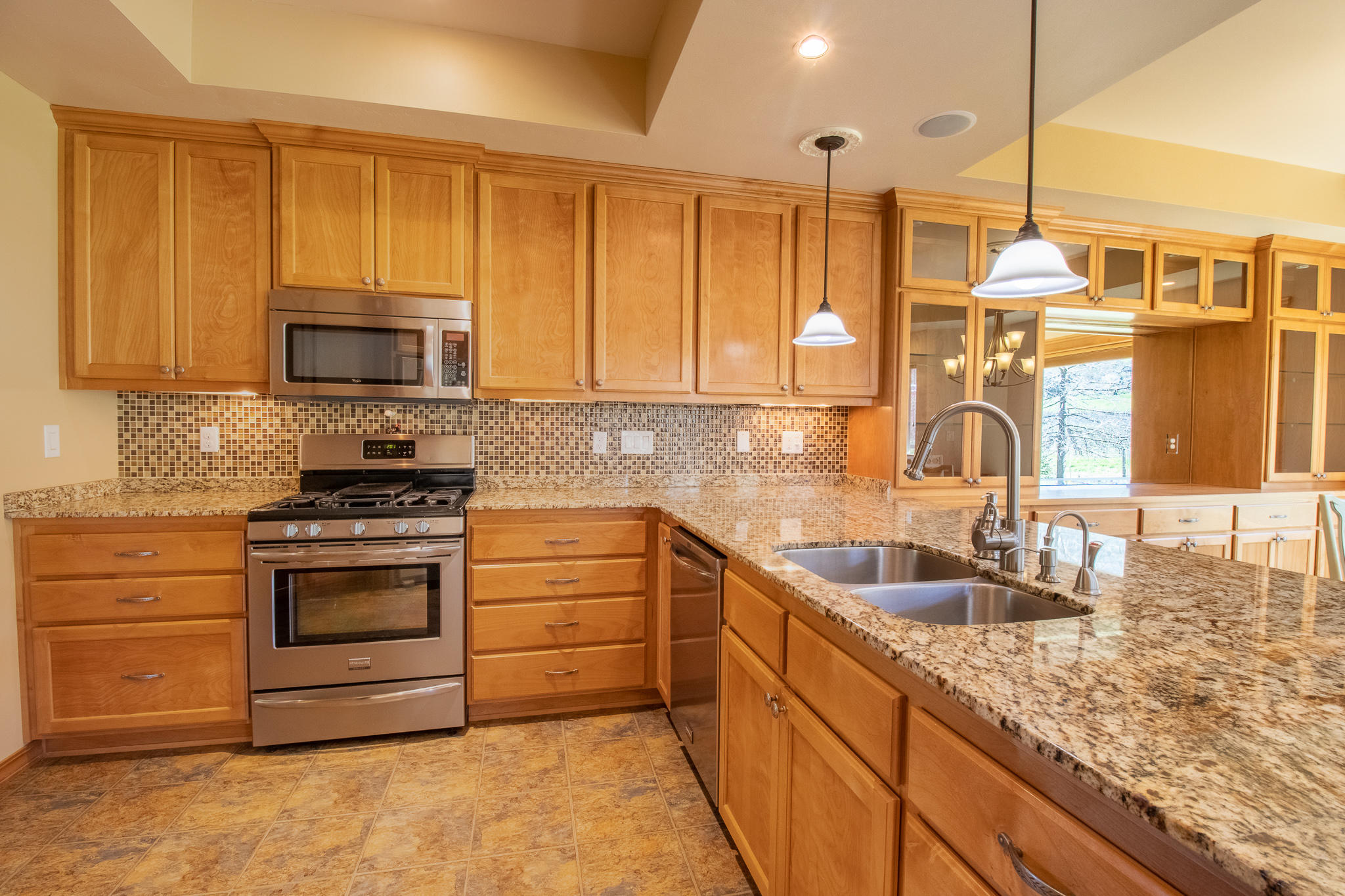 1381 Foss Road Talent, OR 97540 - Photo 11 of 41 Beautiful tile and granite kitchen with loads of cabinetry and built-ins