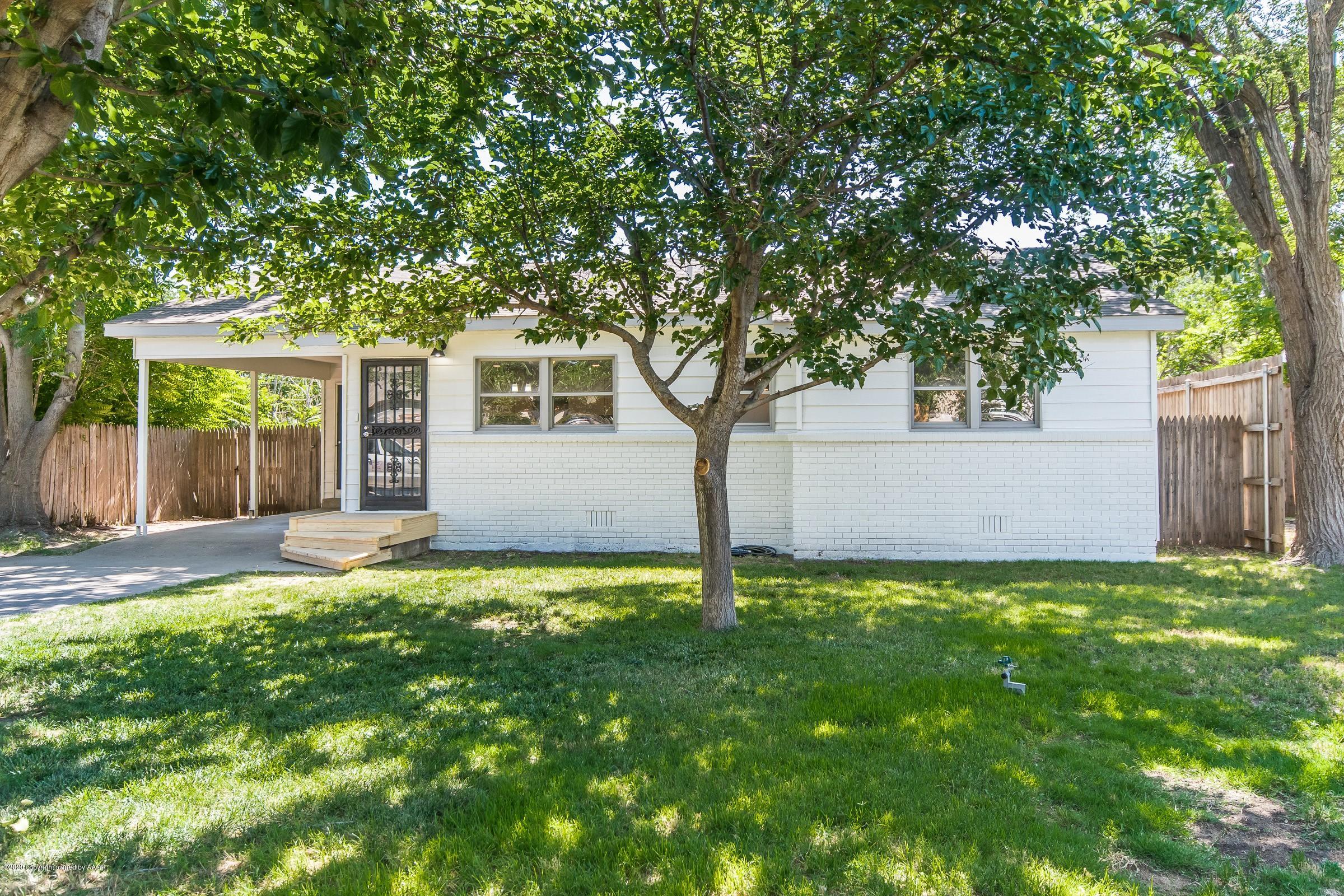 5135 Bowie Street Amarillo, TX 79110 - Photo 1 of 24 a backyard of a house with lots of green space