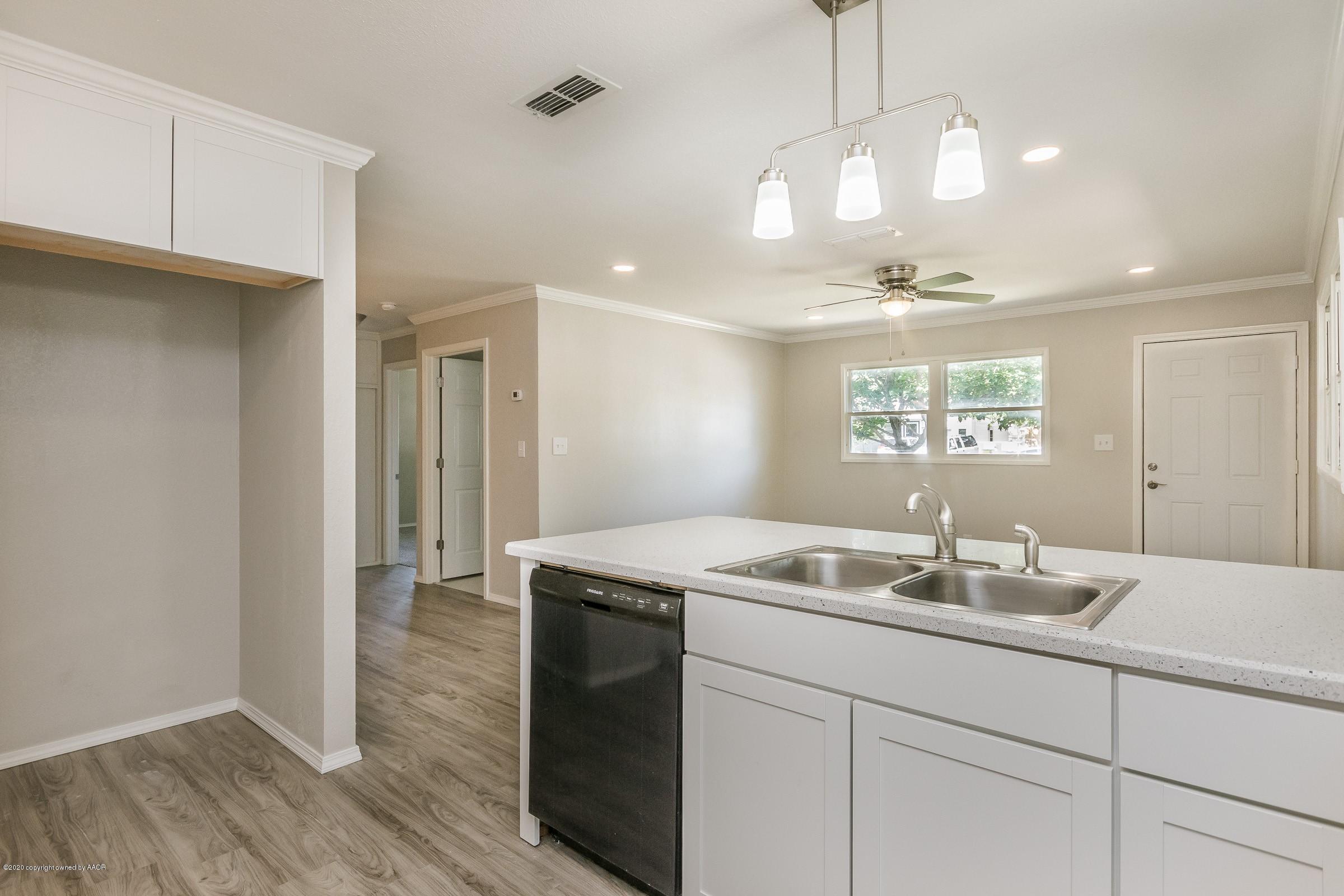 5135 Bowie Street Amarillo, TX 79110 - Photo 8 of 24 a bathroom with a sink and a mirror