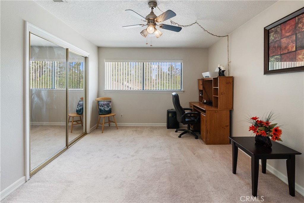 17656 Mockingbird Hill Circle Riverside, CA 92504 - Photo 26 of 49 a livingroom with workspace and a window