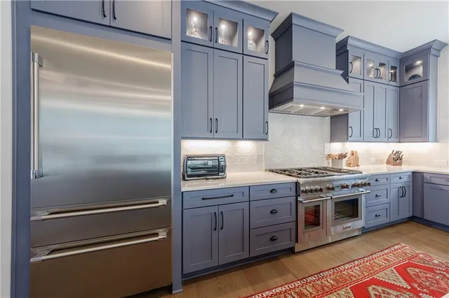 a living room with a fireplace and a flat screen tv