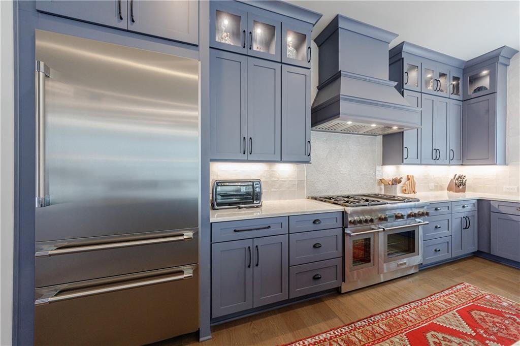 3085 Gray Hawk Lane Roswell, GA 30076 - Photo 17 of 99 a kitchen with granite countertop stainless steel appliances and wooden cabinets
