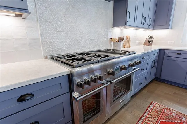 a living room with furniture or kitchen view and a wooden floor