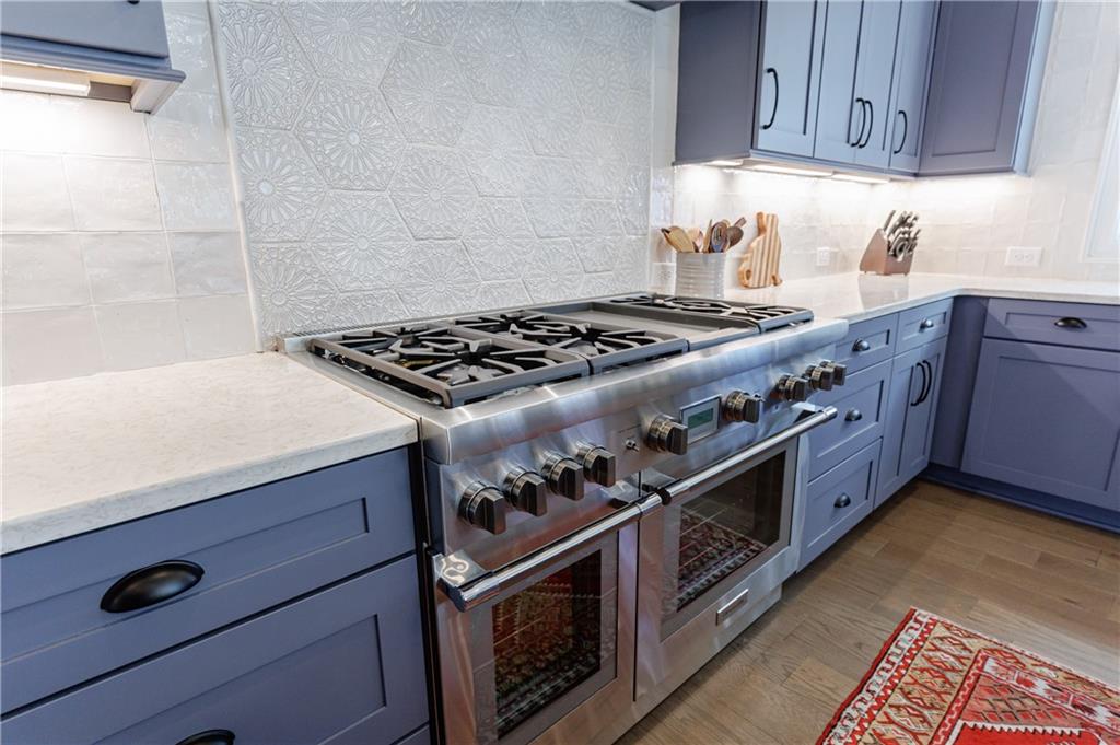 3085 Gray Hawk Lane Roswell, GA 30076 - Photo 18 of 99 a kitchen with granite countertop stainless steel appliances and cabinets