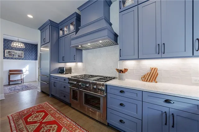 a view of a hallway with wooden floor and stairs