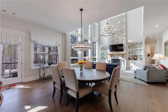 a large spacious bathroom with a double vanity sink a mirror and a bathtub
