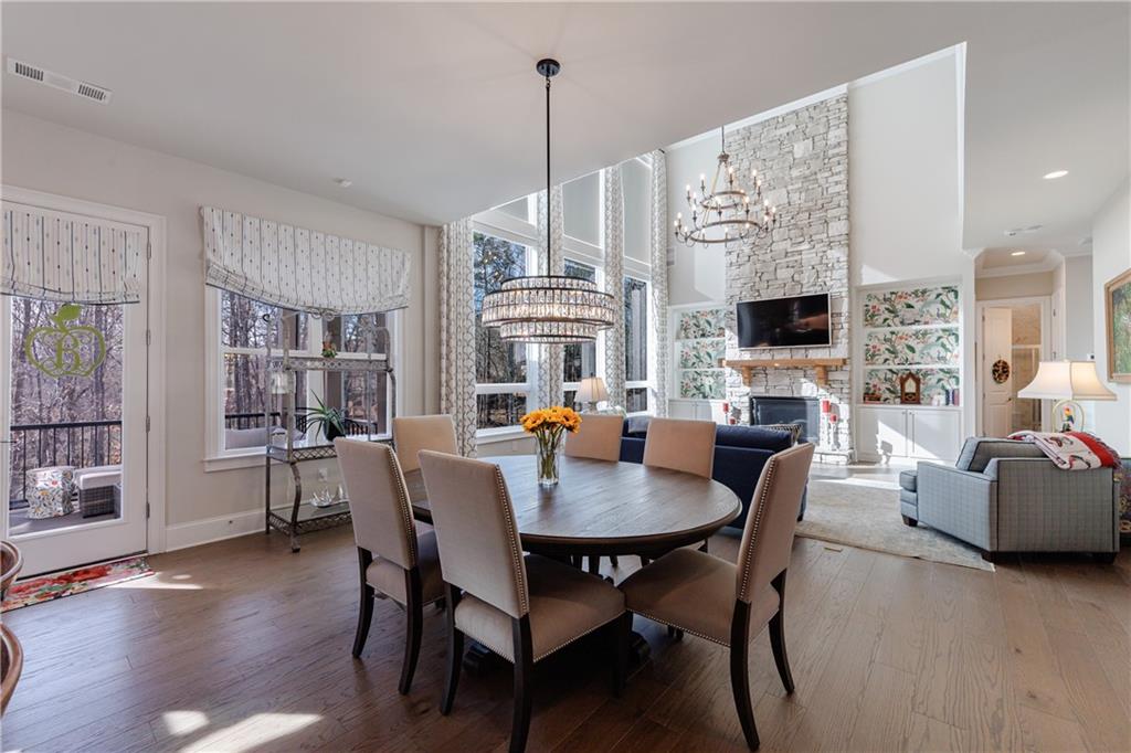 3085 Gray Hawk Lane Roswell, GA 30076 - Photo 27 of 99 a view of a dining room with furniture window and wooden floor