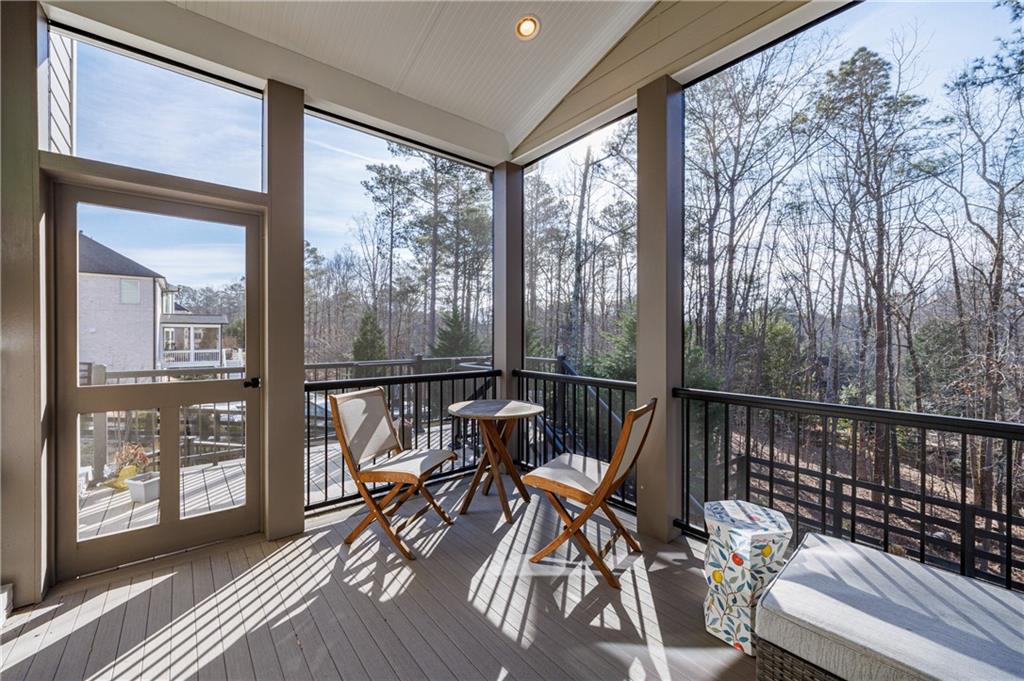 3085 Gray Hawk Lane Roswell, GA 30076 - Photo 35 of 99 a view of a balcony with chairs and wooden floor