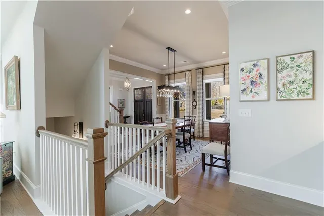 a bedroom with two beds and a chandelier