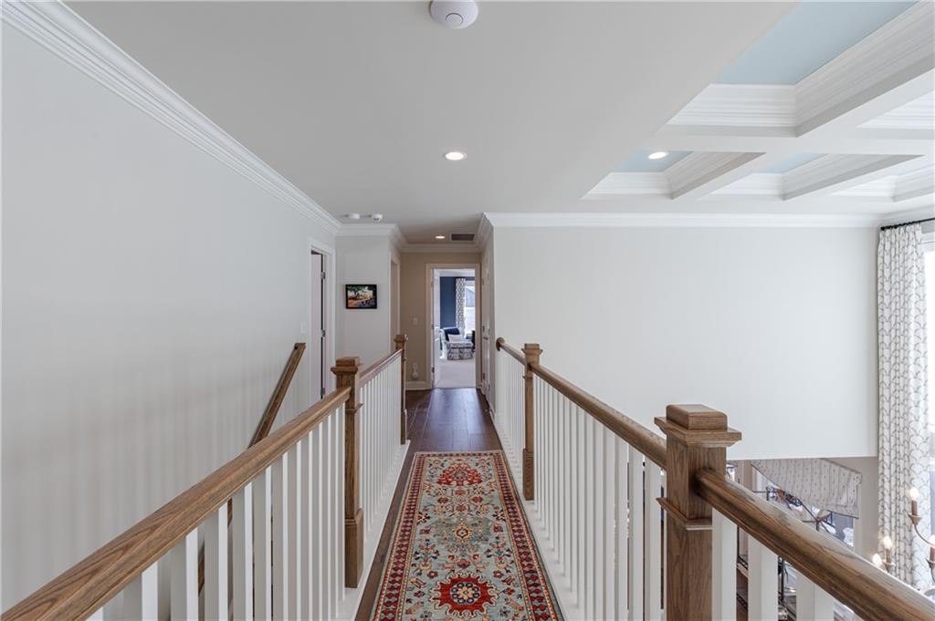 3085 Gray Hawk Lane Roswell, GA 30076 - Photo 39 of 99 a view of a hallway with wooden floor and stairs