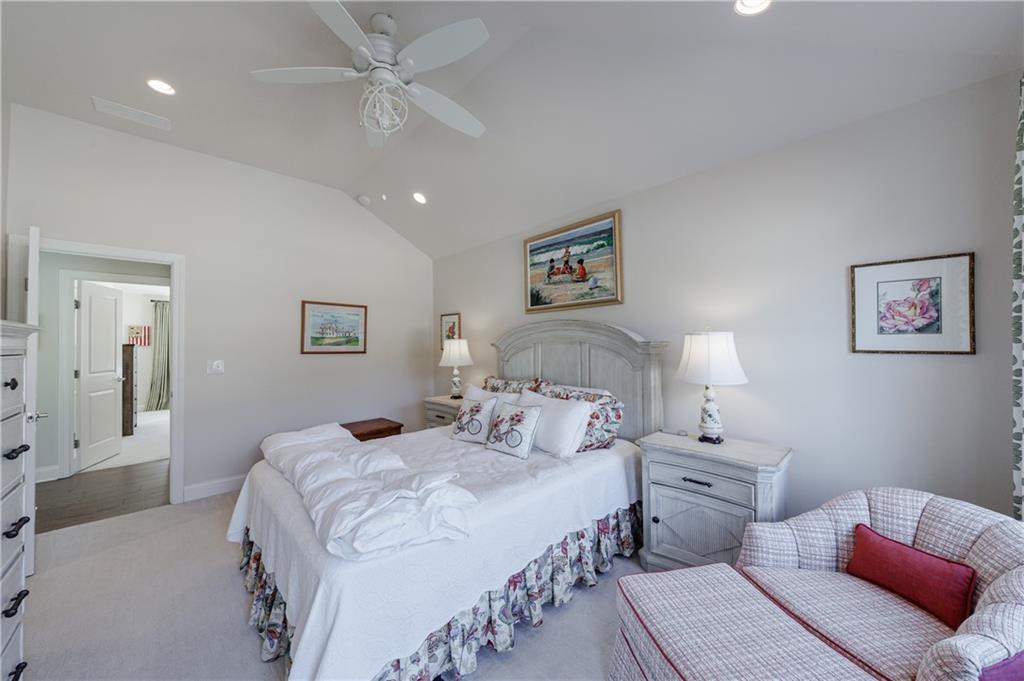 3085 Gray Hawk Lane Roswell, GA 30076 - Photo 58 of 99 a bedroom with double bed and a chandelier