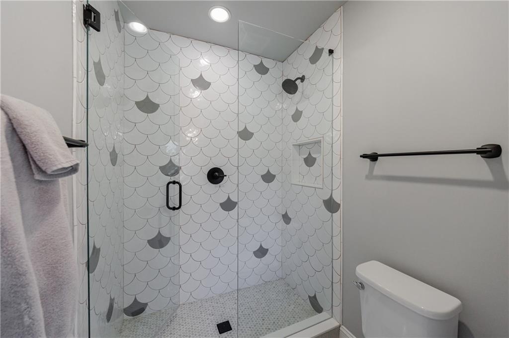 3085 Gray Hawk Lane Roswell, GA 30076 - Photo 61 of 99 a bathroom with a shower toilet and sink