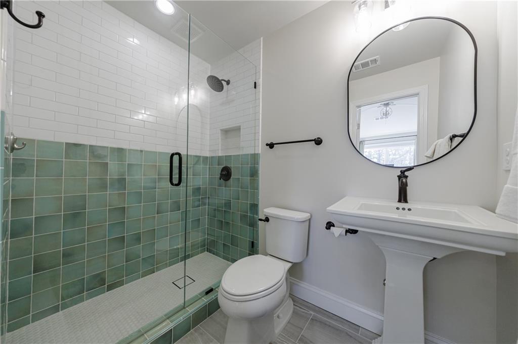 3085 Gray Hawk Lane Roswell, GA 30076 - Photo 64 of 99 a bathroom with a sink toilet and a mirror