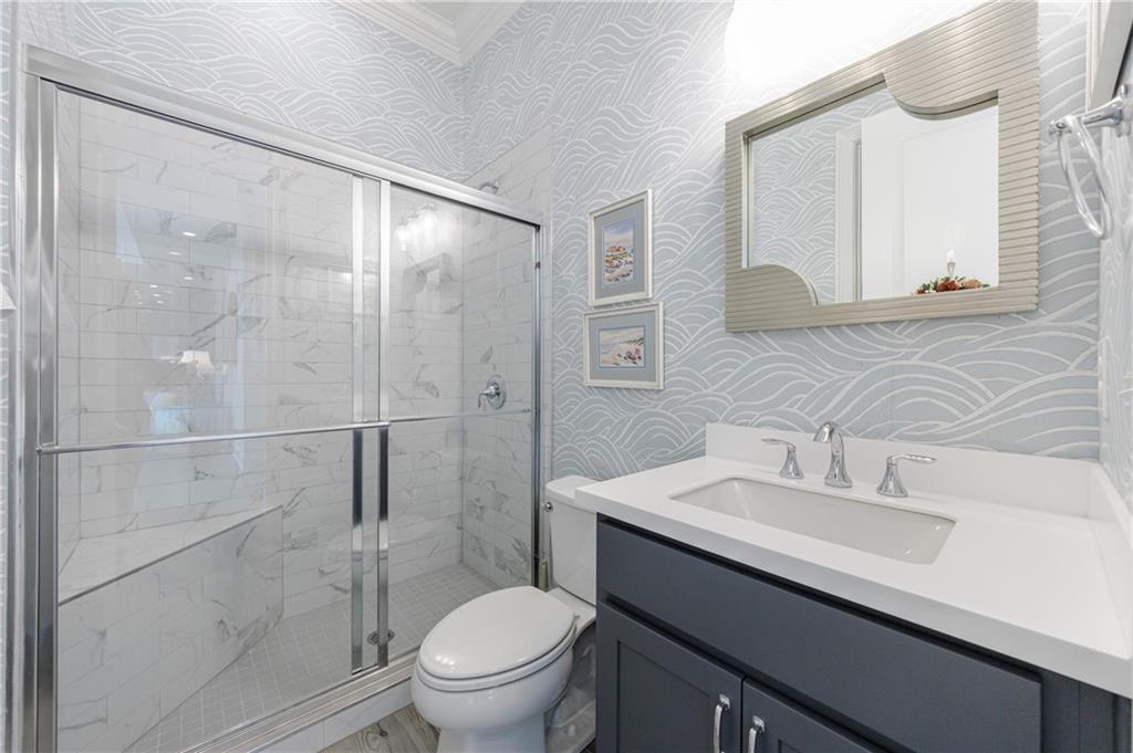 3085 Gray Hawk Lane Roswell, GA 30076 - Photo 70 of 99 a bathroom with a sink toilet and shower